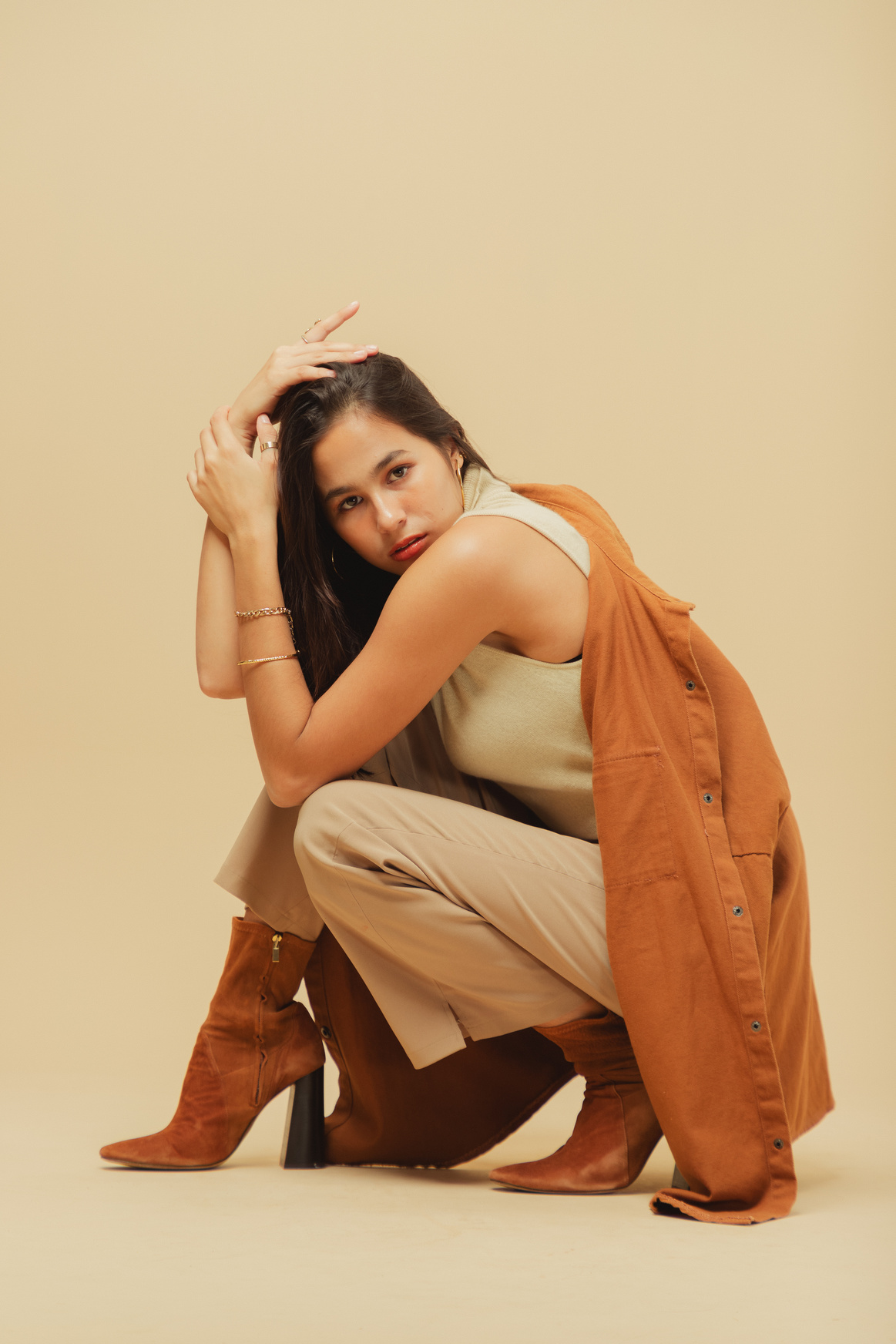 Woman in Beige Monochrome Outfit on Beige Background